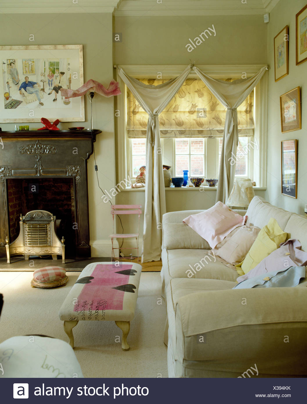 Pastel Linen Cushions On White Sofa In Pale Gray Living Room