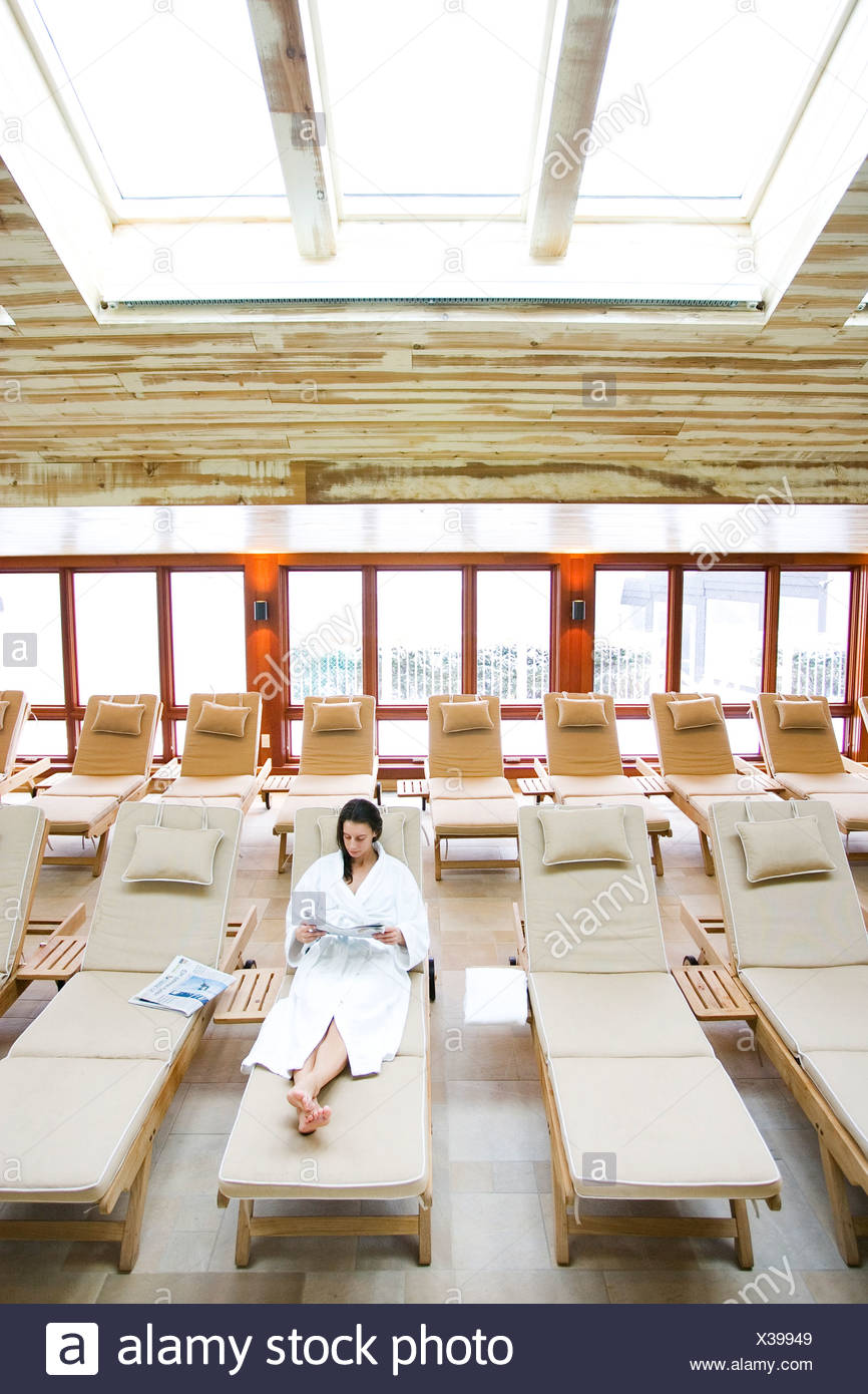 chase lounges indoors on Woman In A White Robe Reading In A Chaise Lounge By The Indoor Pool At A Spa Stowe Vt Stock Photo Alamy