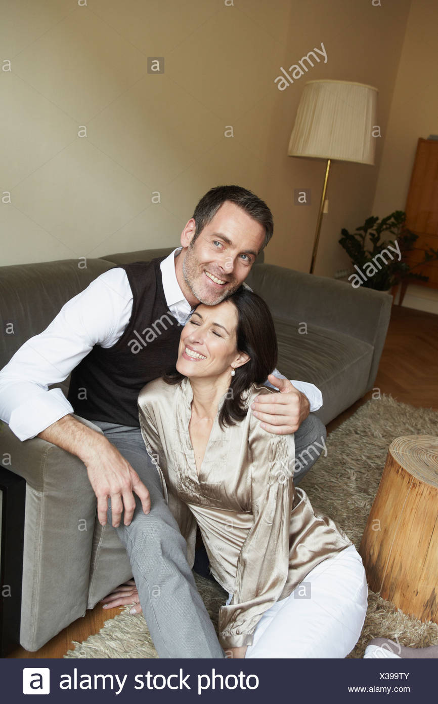 Couple Snuggling On Couch Stock Photo 277415179 Alamy