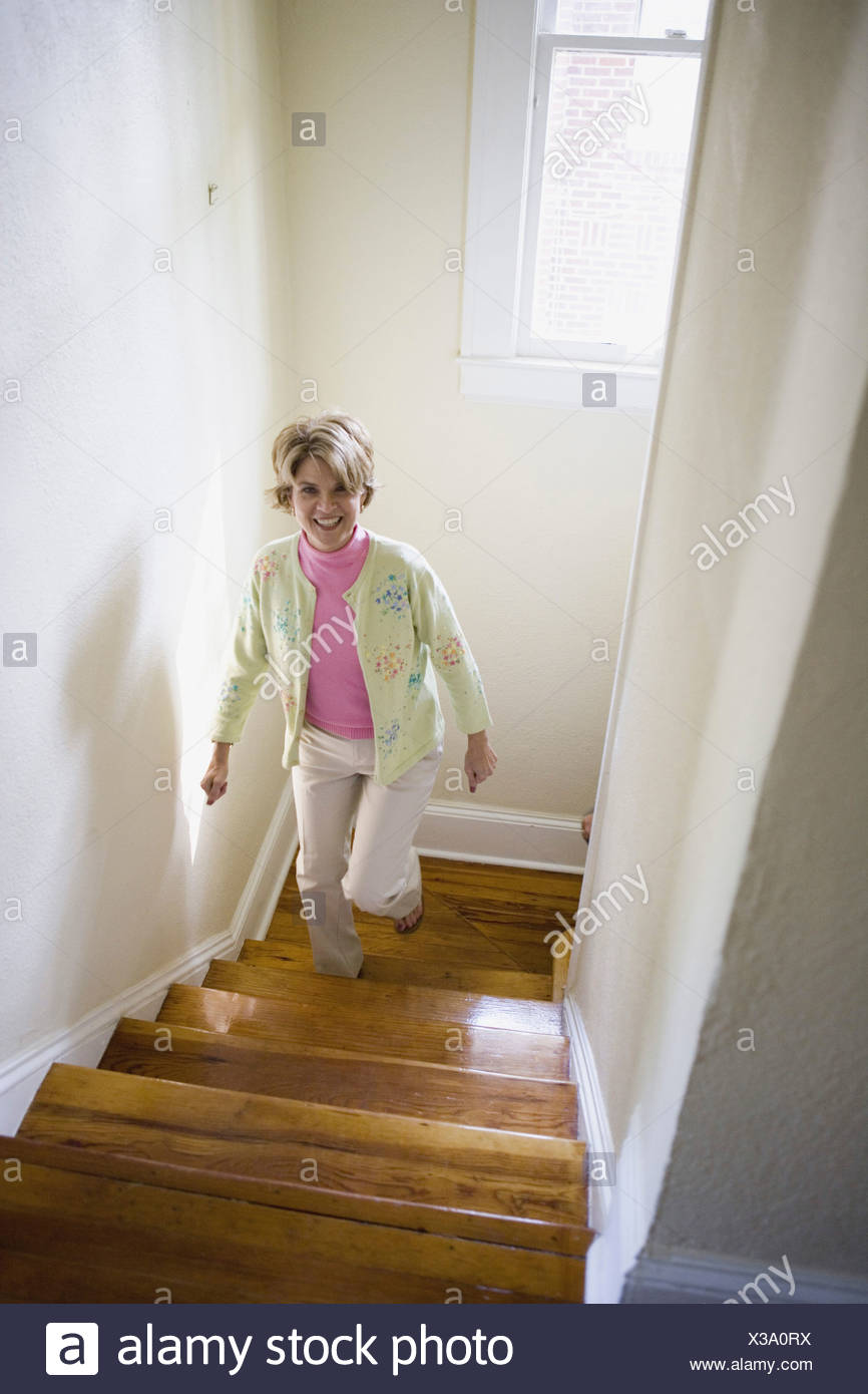 Mature Woman Climbing Stairs Stock Photos & Mature Woman Climbing ...