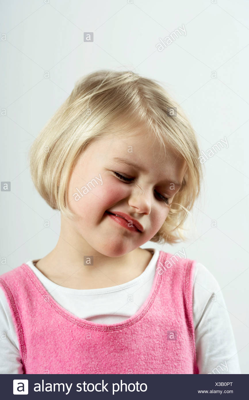 A young girl with a skeptical look Stock Photo