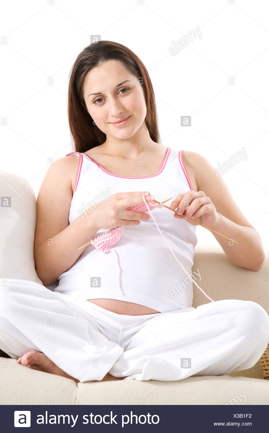 pic Sitting Cross Legged During Pregnancy https www alamy com pregnant young woman sitting cross legged knitting image277452534 html