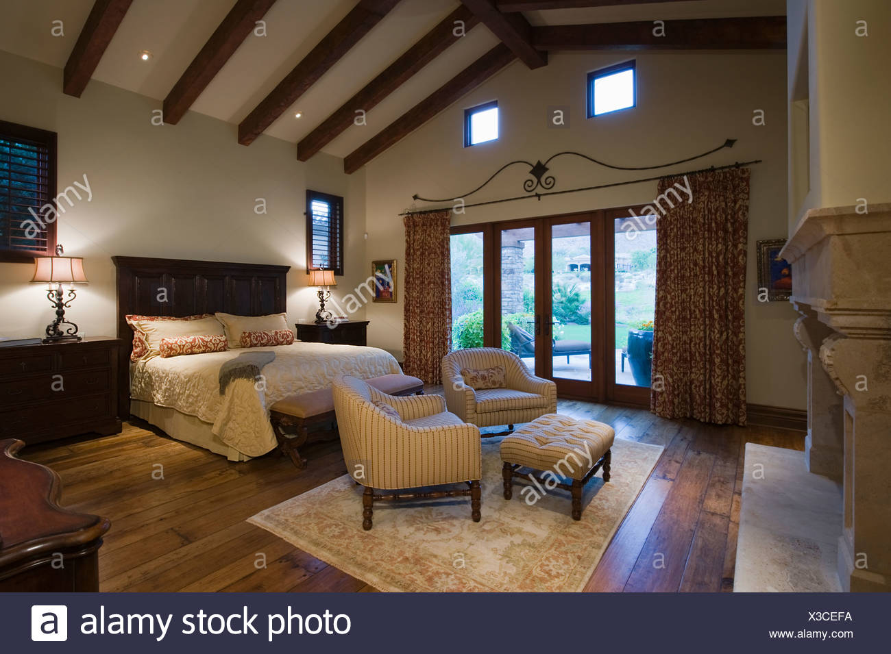 Seating Area In Beamed Palm Springs Bedroom Stock Photo