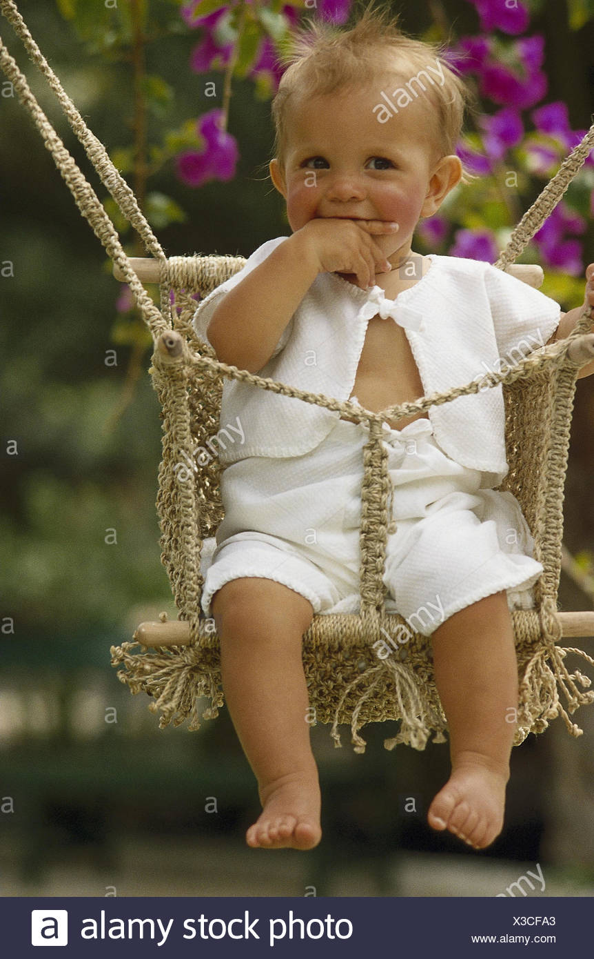 Garden, baby swing, baby, happily, gesture ommer, child, infant, swing,  sit, cheerfulness, smile, childhood, carefree nature, happily, hand, mouth,  swing, play Stock Photo - Alamy
