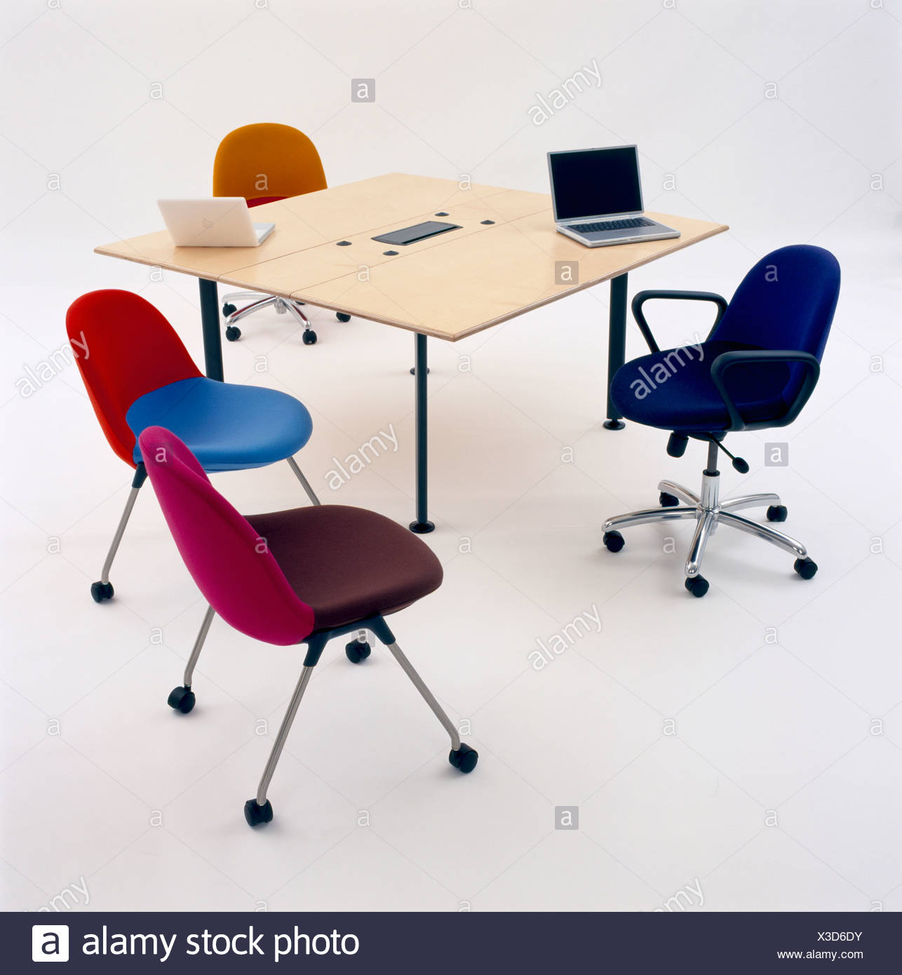 Laptop Computer On Square Table With Colourful Upholstered Office