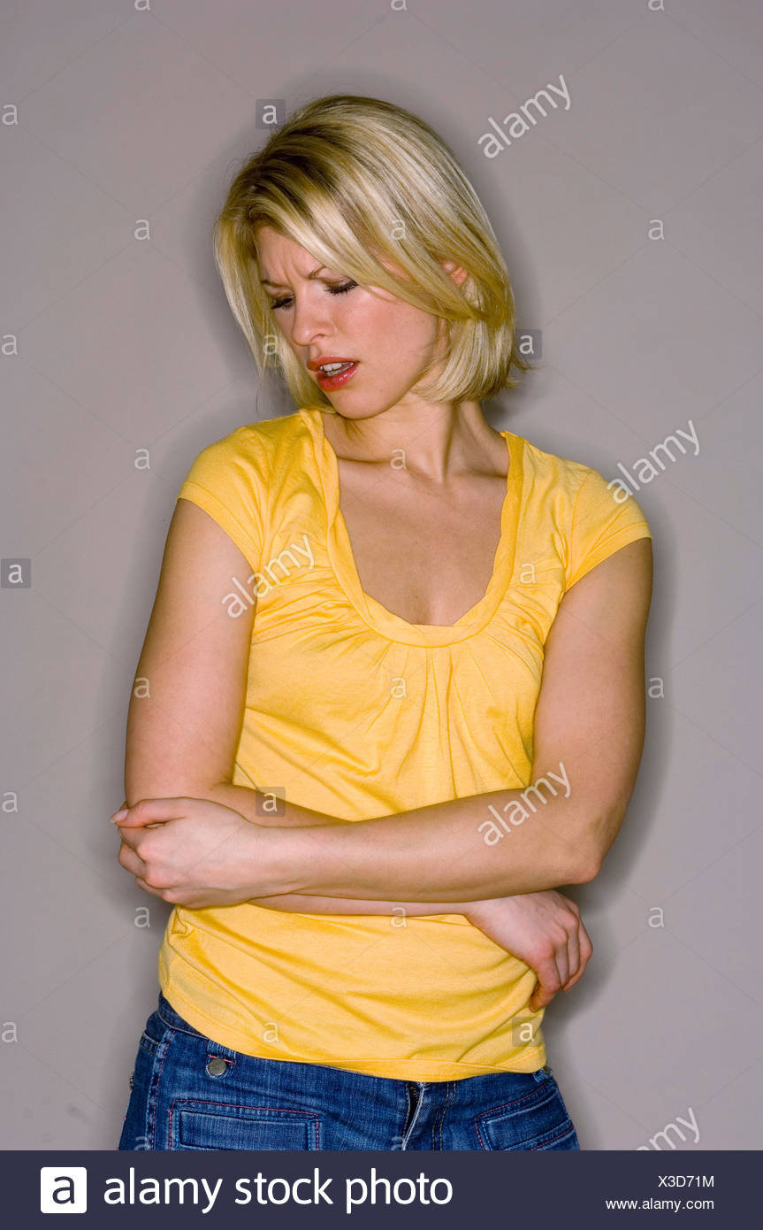 Female With Shoulder Length Blonde Hair Wearing Yellow Short
