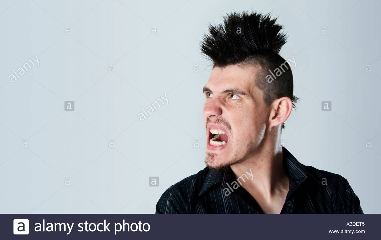 Man Is Super Angry And Sports A Mohawk Haircut Stock Photo