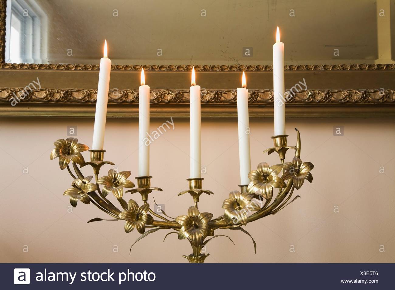 Close Up Of A Candelabra With Lit White Candles In The
