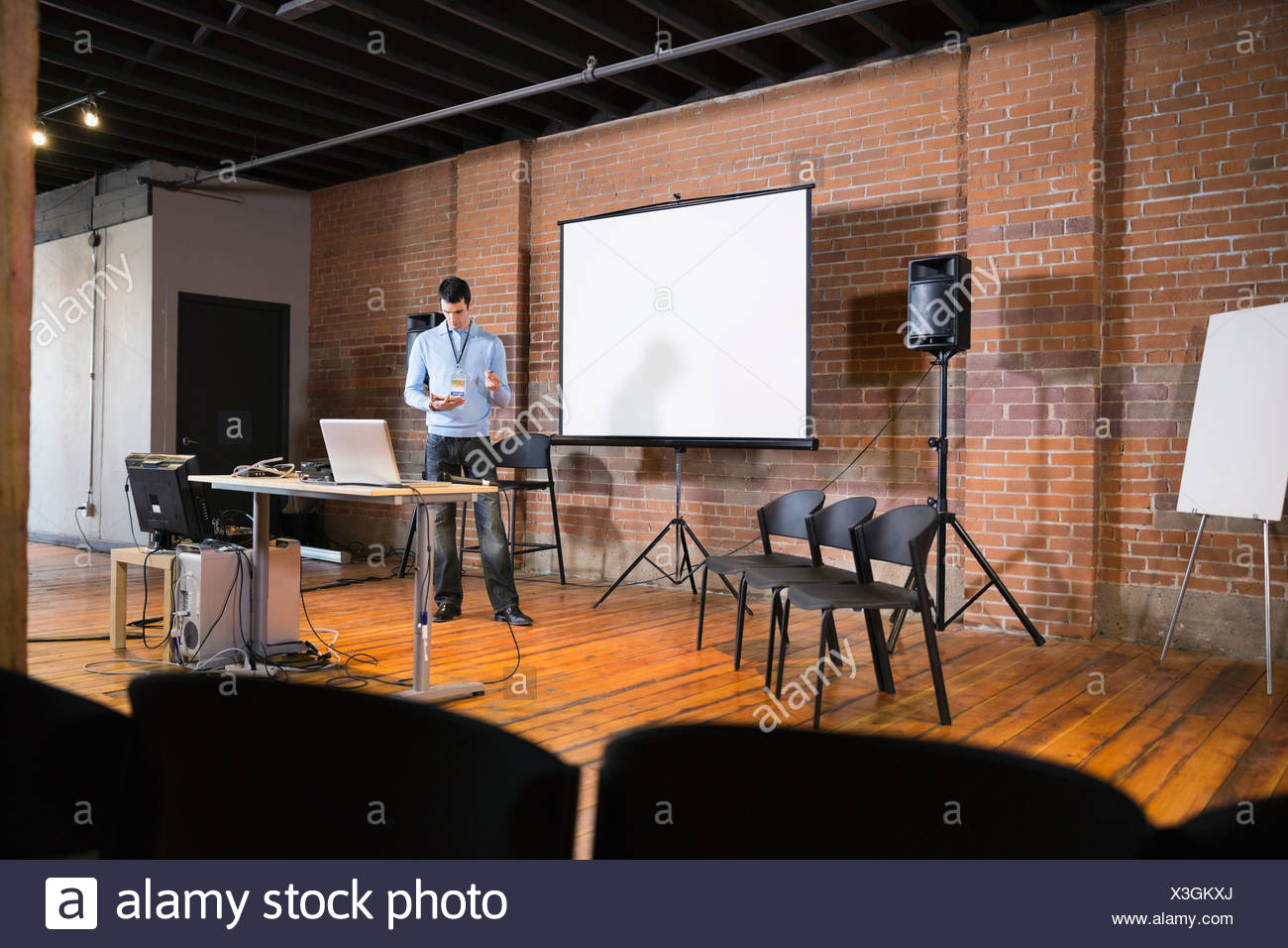 Entrepreneur Preparing For Presentation In Conference Room