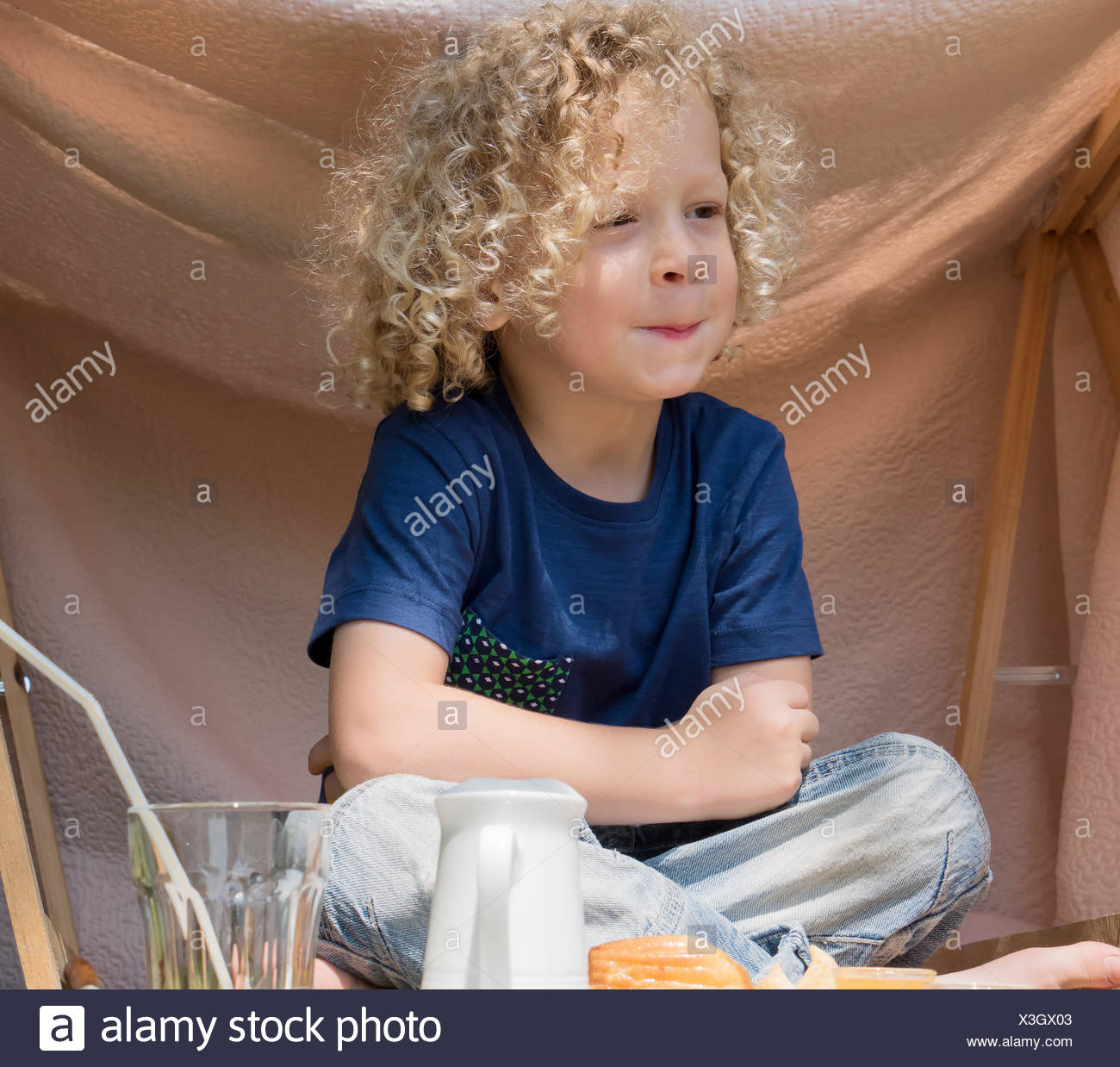 Little Boy With Curly Blond Hair Outside Stock Photo 277581475