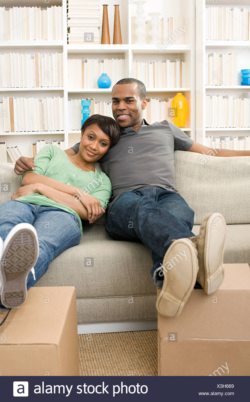 A Woman With Feet On A Sofa Stock Photos & A Woman With Feet On A Sofa