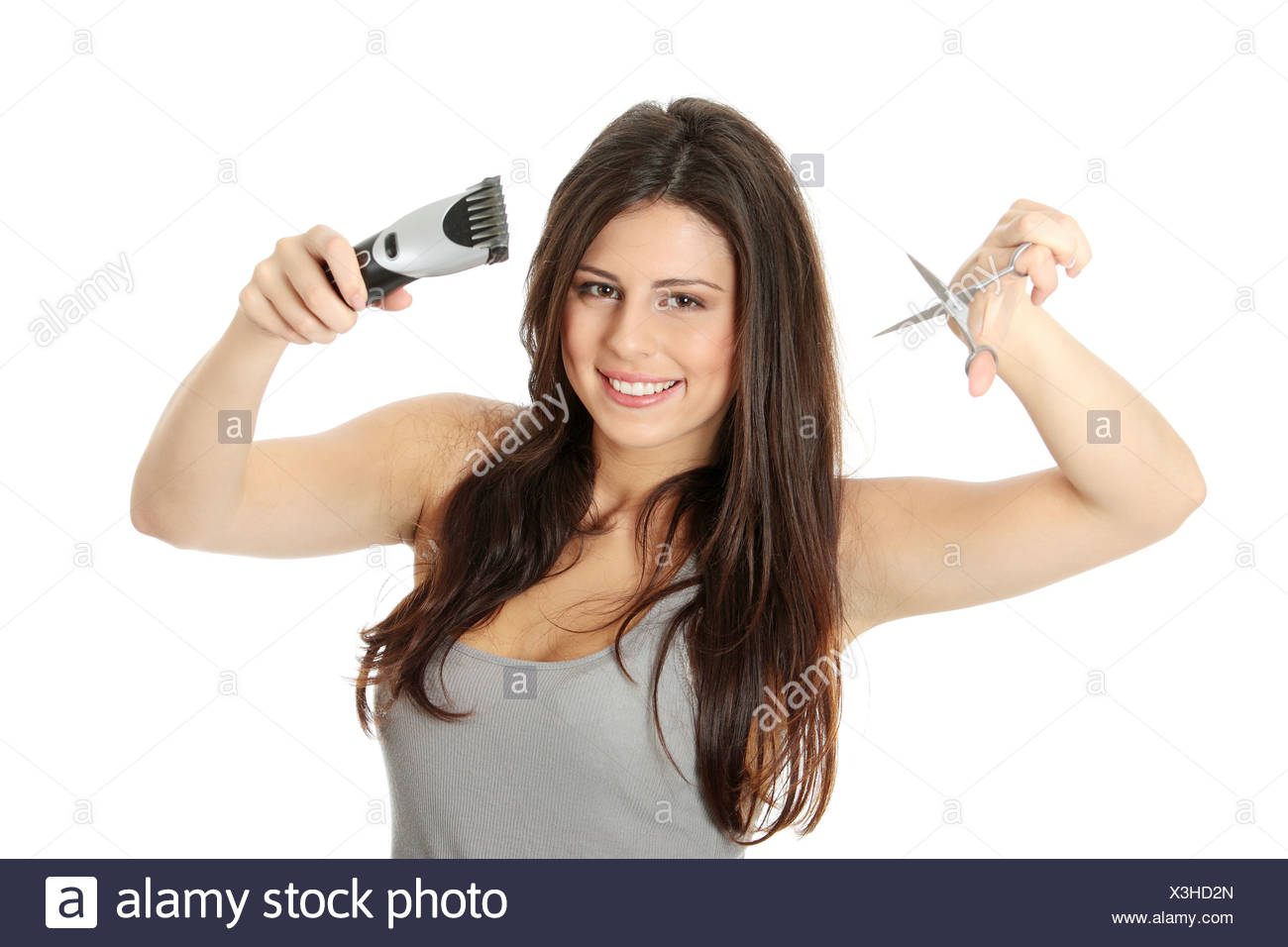 Young Beautiful Female Hairdresser Holding Scissors And Hair