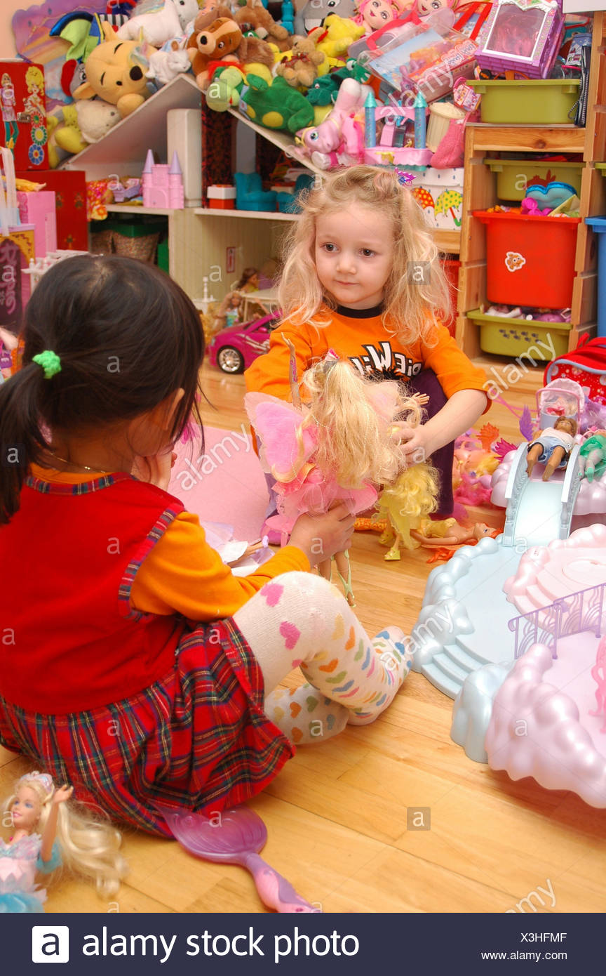 kids playing with barbie dolls