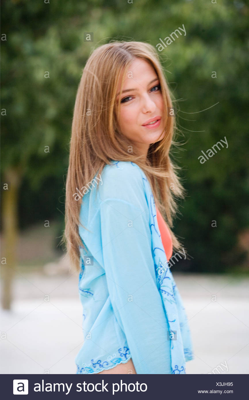 Female Long Straight Dark Blonde Hair Wearing Orange Bikini Top