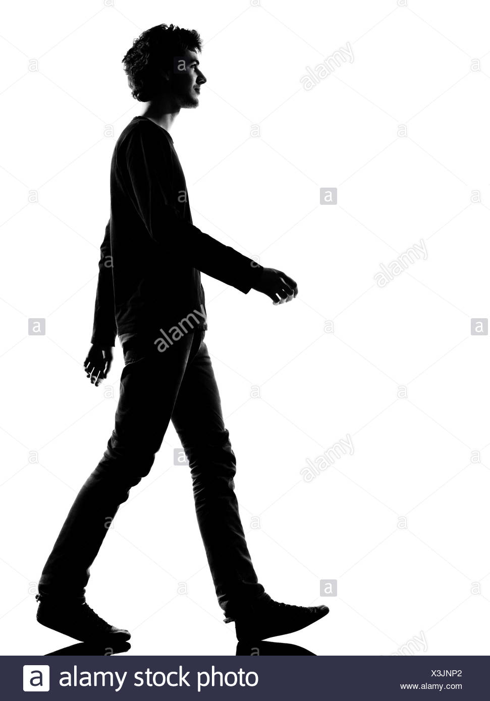 Young Man Sad Walking Silhouette In Studio Isolated On White Background Stock Photo Alamy