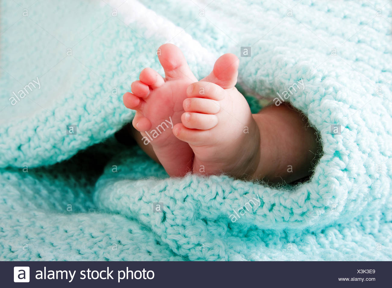 blanket-baby-foot-feet-funny-maddening-pert-coquettish-cute-cloth-blue-green-X3K3E9.jpg