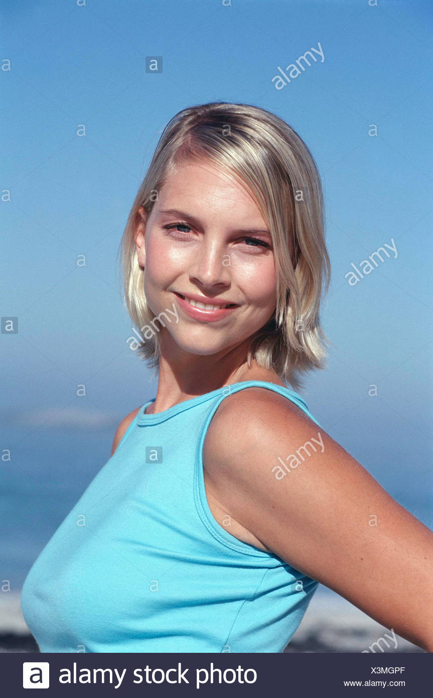 Semi Profile Of Tanned Female Chin Length Blonde Hair Wearing