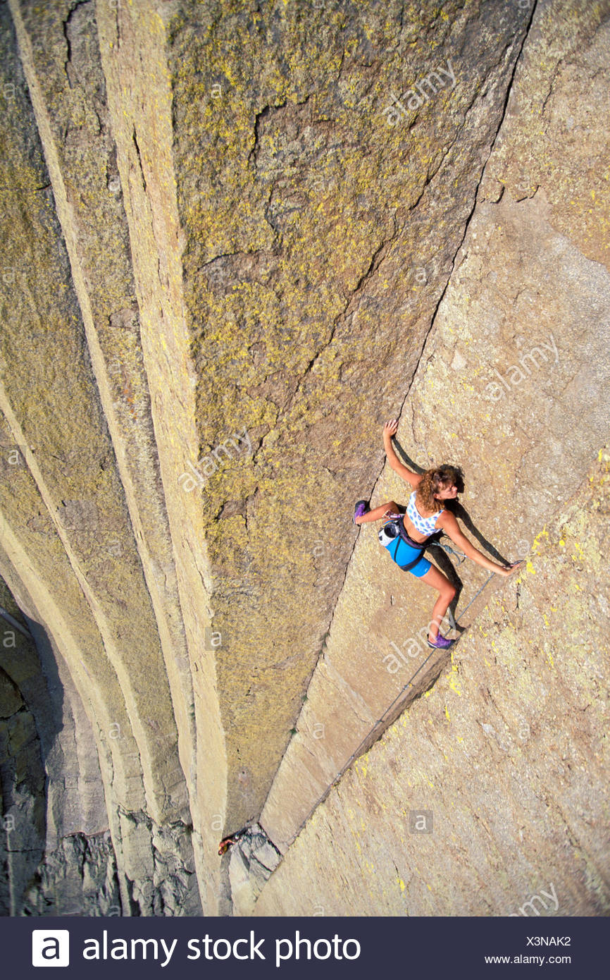 Woman rock climbing, Devil's Tower, Wyoming Stock Photo ...