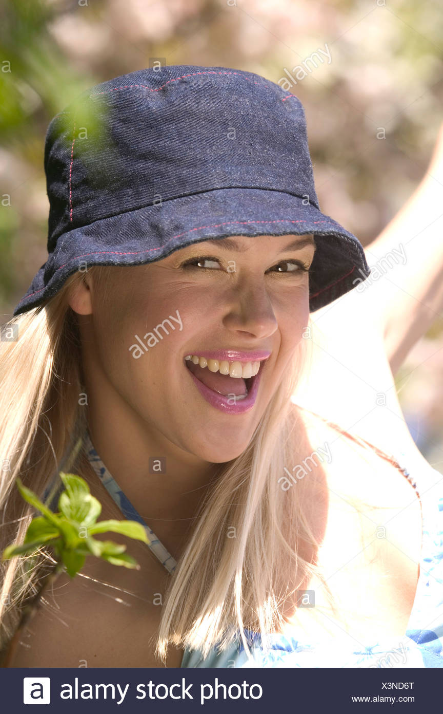 Female Long Blonde Hair Wearing Dark Blue Denim Sun Hat And