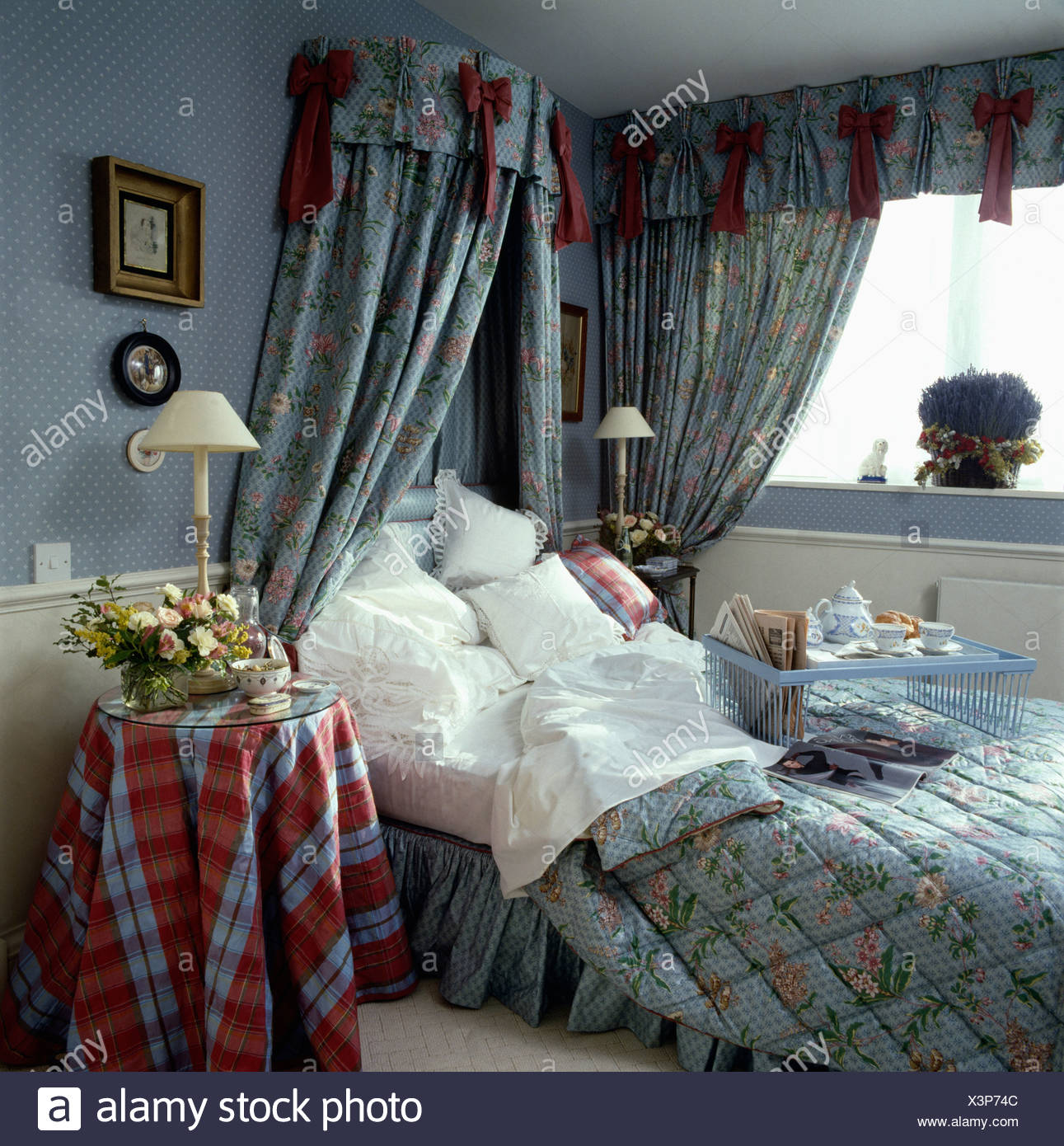 Patterned Blue Quilt And Matching Drapes On Coronet Bed With