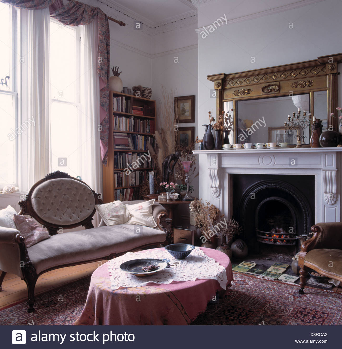 Pink Cloth On Oval Coffee Table In Front On Antique French Style