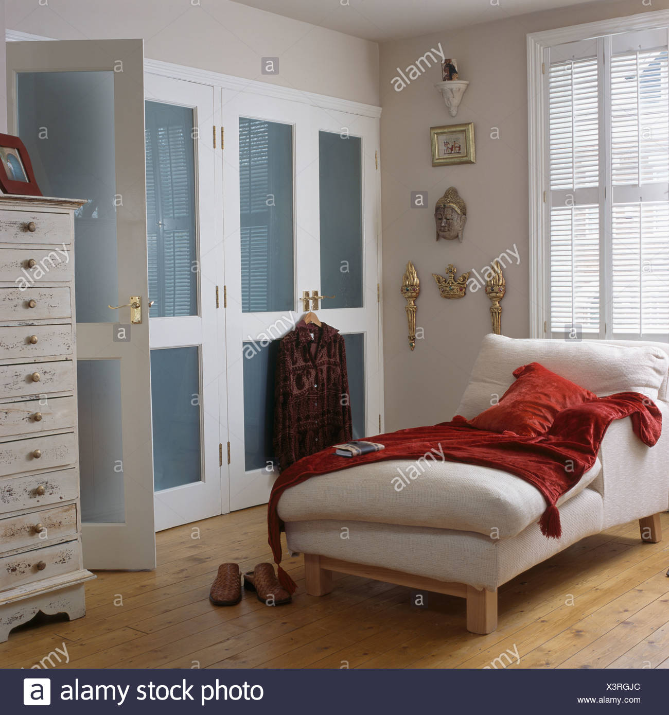 Red Velvet Throw On White Chaise Longue In Townhouse Bedroom With