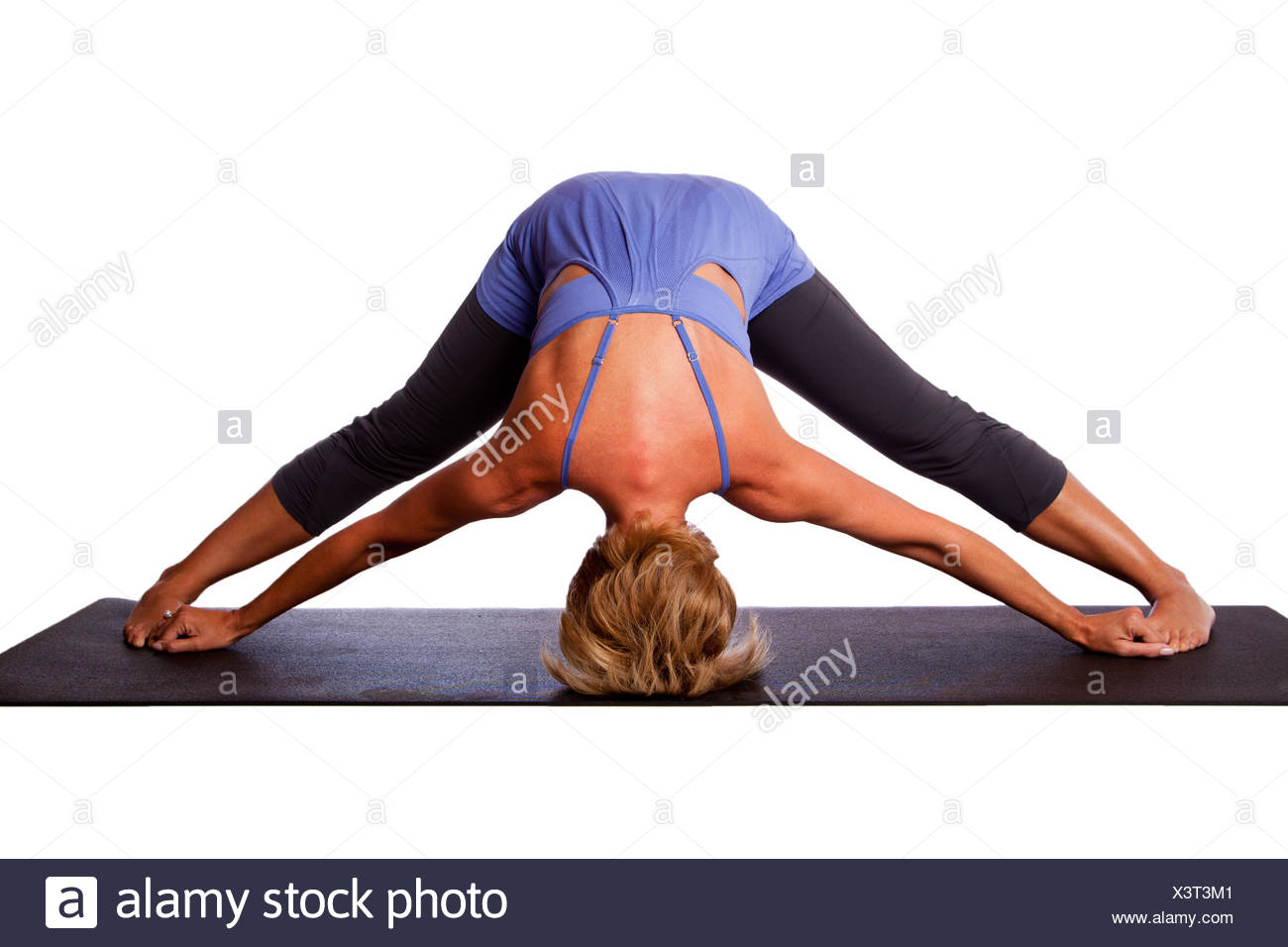 Beautiful Healthy Woman Doing Inversion Standing Intense Spread