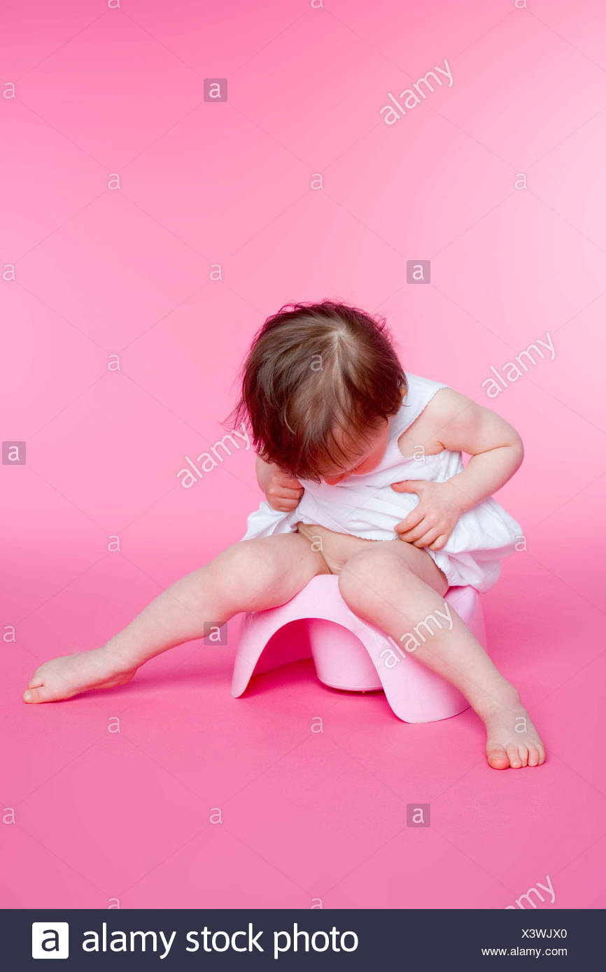 Young Girl Sitting On Toilet Stock Photos & Young Girl Sitting On