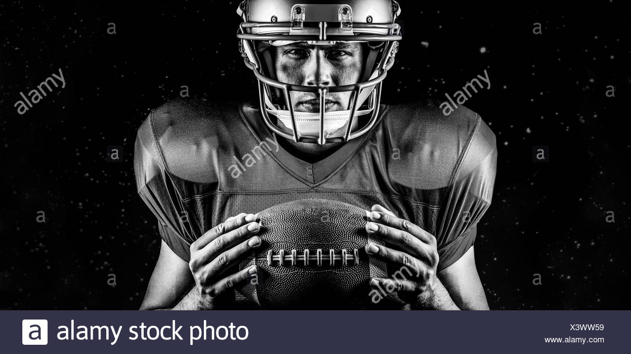 Composite Image Of Close Up Portrait Of Confident American Football Player Holding Ball Stock Photo Alamy