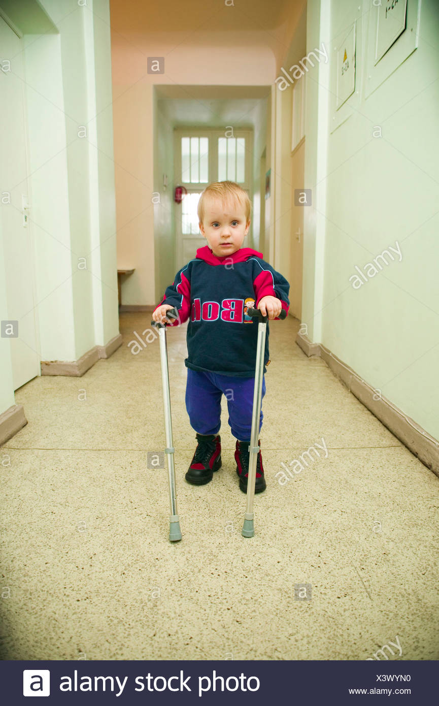 Boy With Crutches High Resolution Stock Photography and Images Alamy