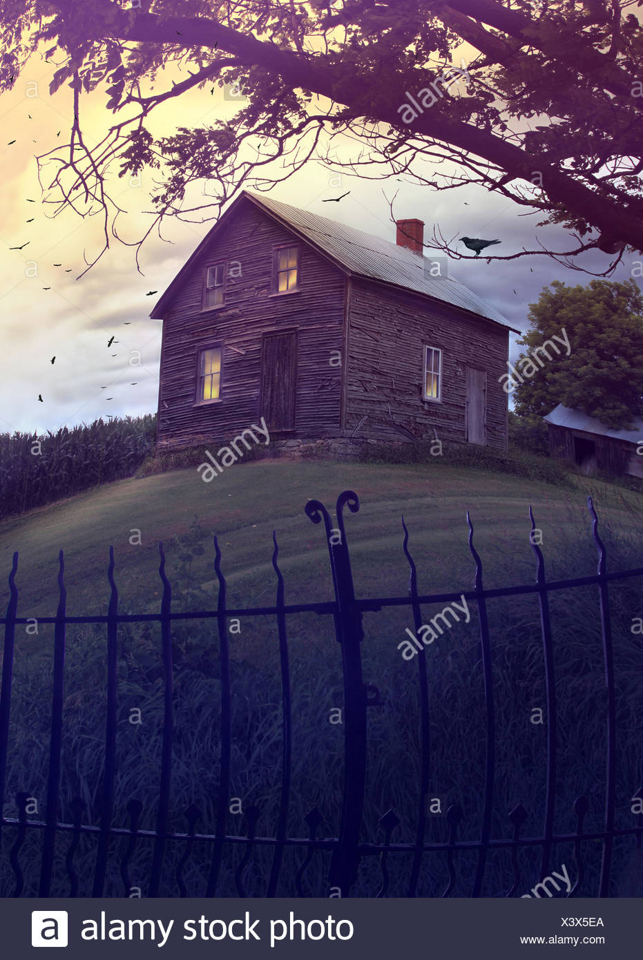 Abandoned haunted house on a hillside Stock Photo