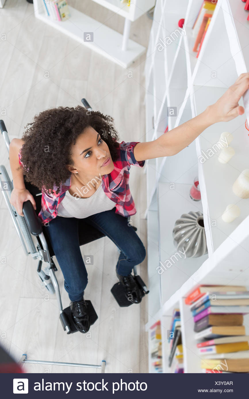 Reaching High Shelf High Resolution Stock Photography and Images Alamy