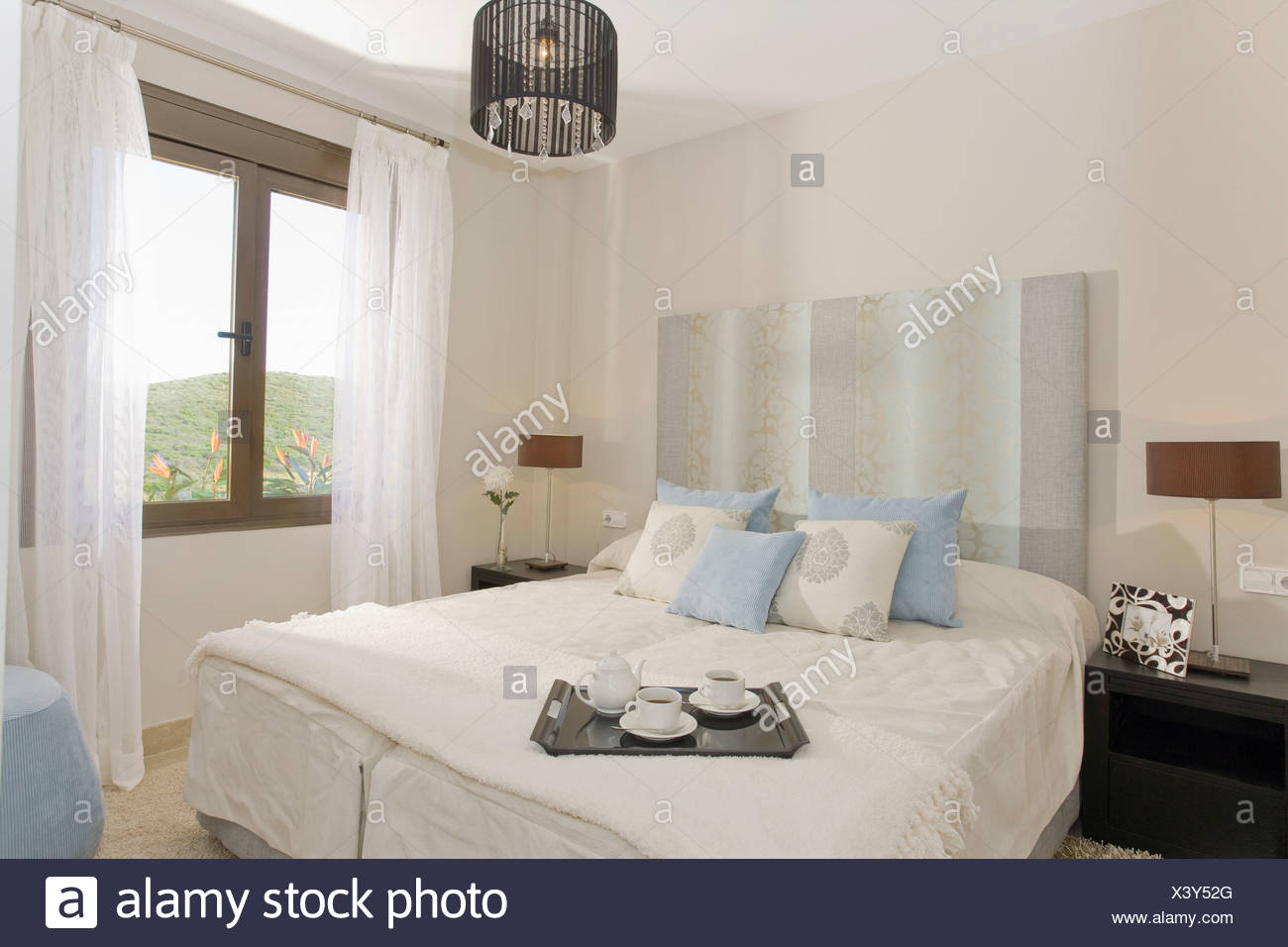 Pale Blue Striped Headboard And Pastel Blue And Cream