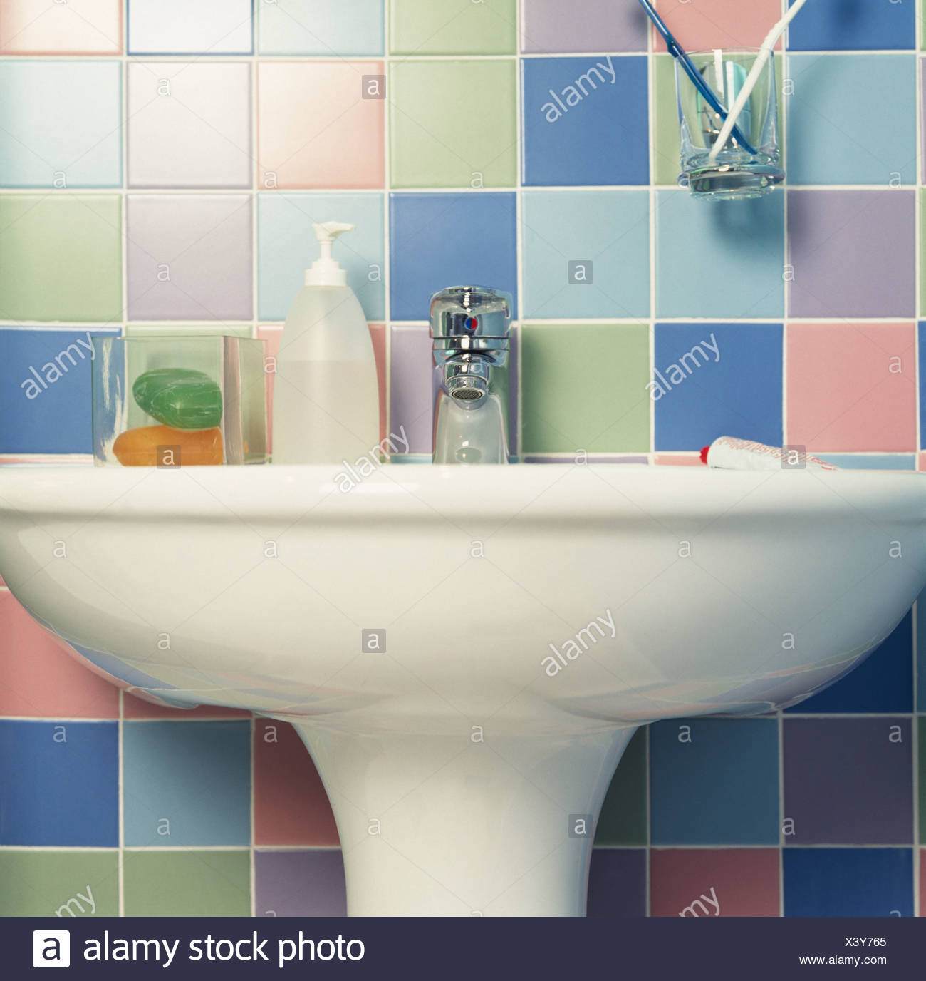 Coloured Tiles Behind Bathroom Basin Stock Photo 277808221
