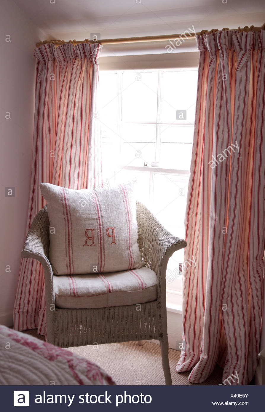 Monogrammed Vintage Linen Cushion On Painted Lloyd Loom Chair In