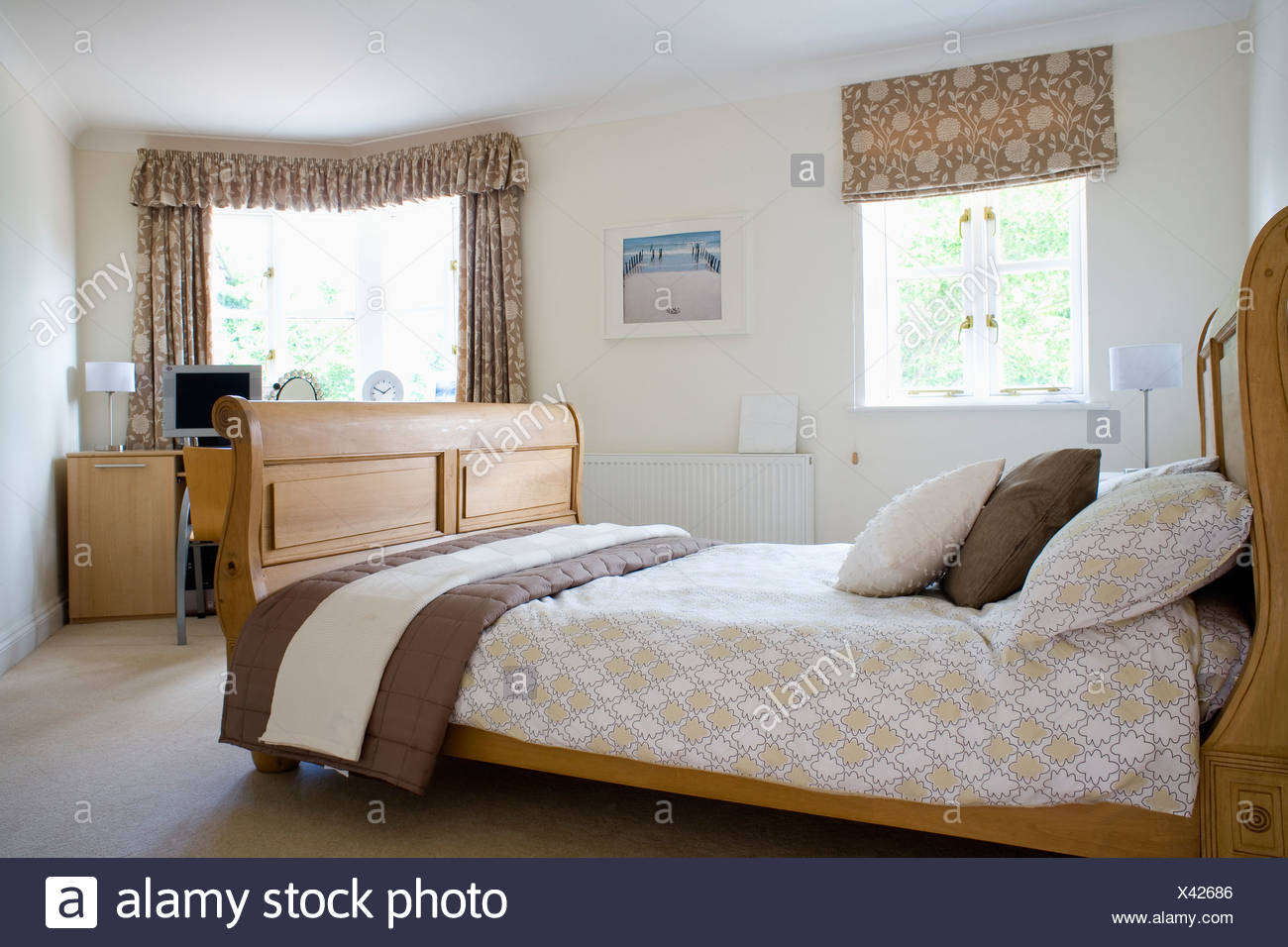 Patterned Brown Cream Blind And Matching Curtains On Windows