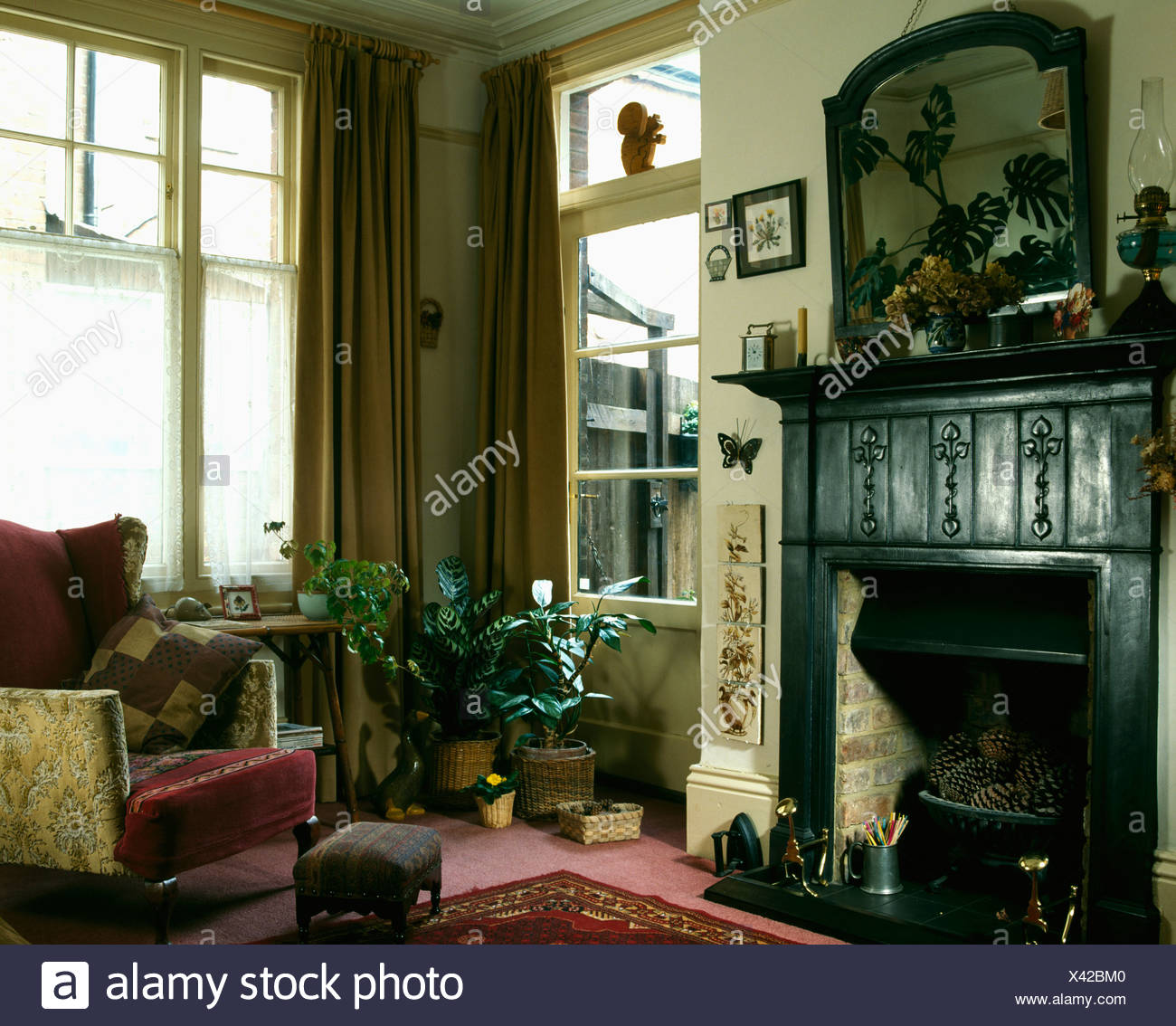 Traditional Black Cast Iron Fireplace In Nineties Living