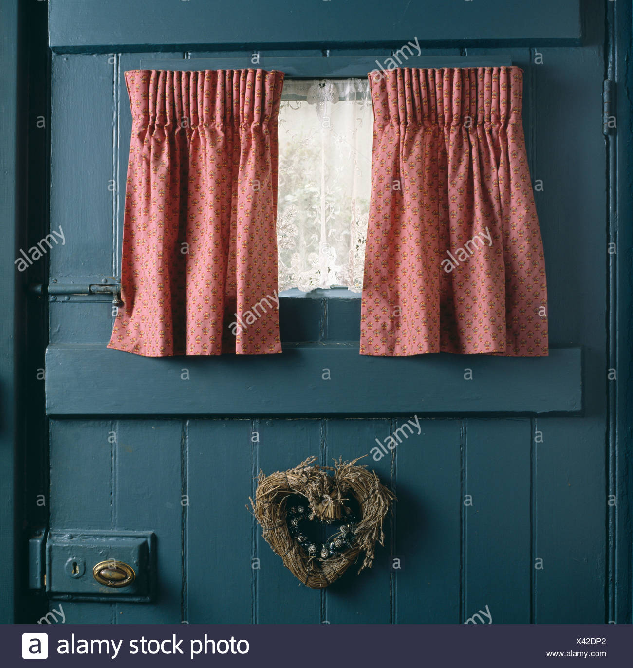 Close Up Of Pink Curtains And White Lace Curtain At Small