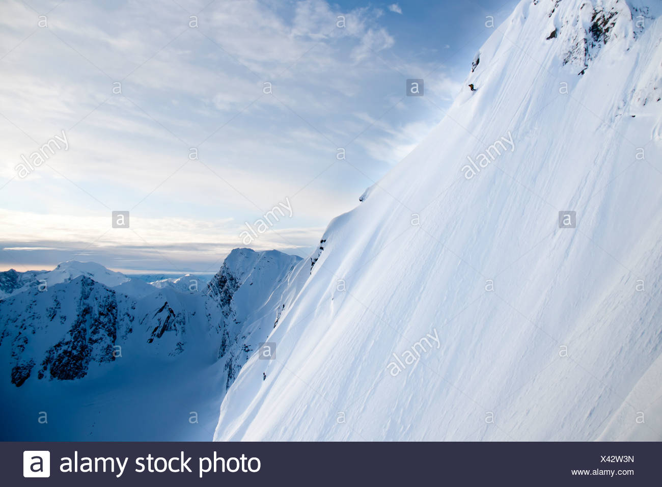 Man Skiing Steep Powder On The Southwest Face Of Kickstep Mountain Turnagain Pass Kenai Mountains In Southcentral Alaska Stock Photo Alamy