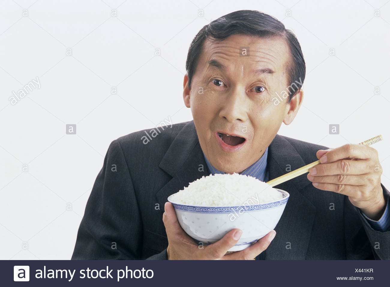 Portrait Of Man Holding A Bowl Of Rice Stock Photo Alamy