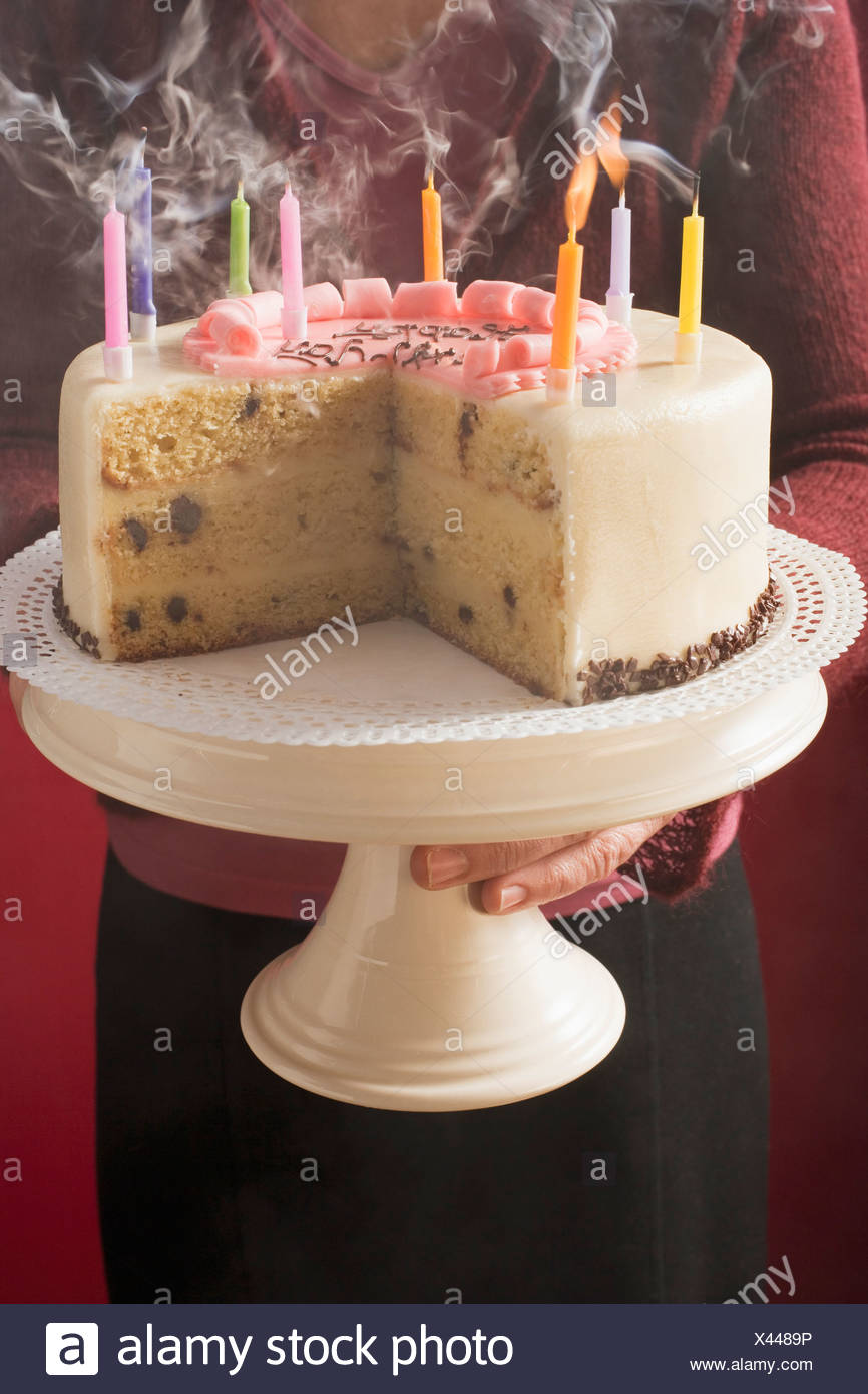 Woman Serving Birthday Cake With Blown Out Candles Foodcollection Stock Photo Alamy