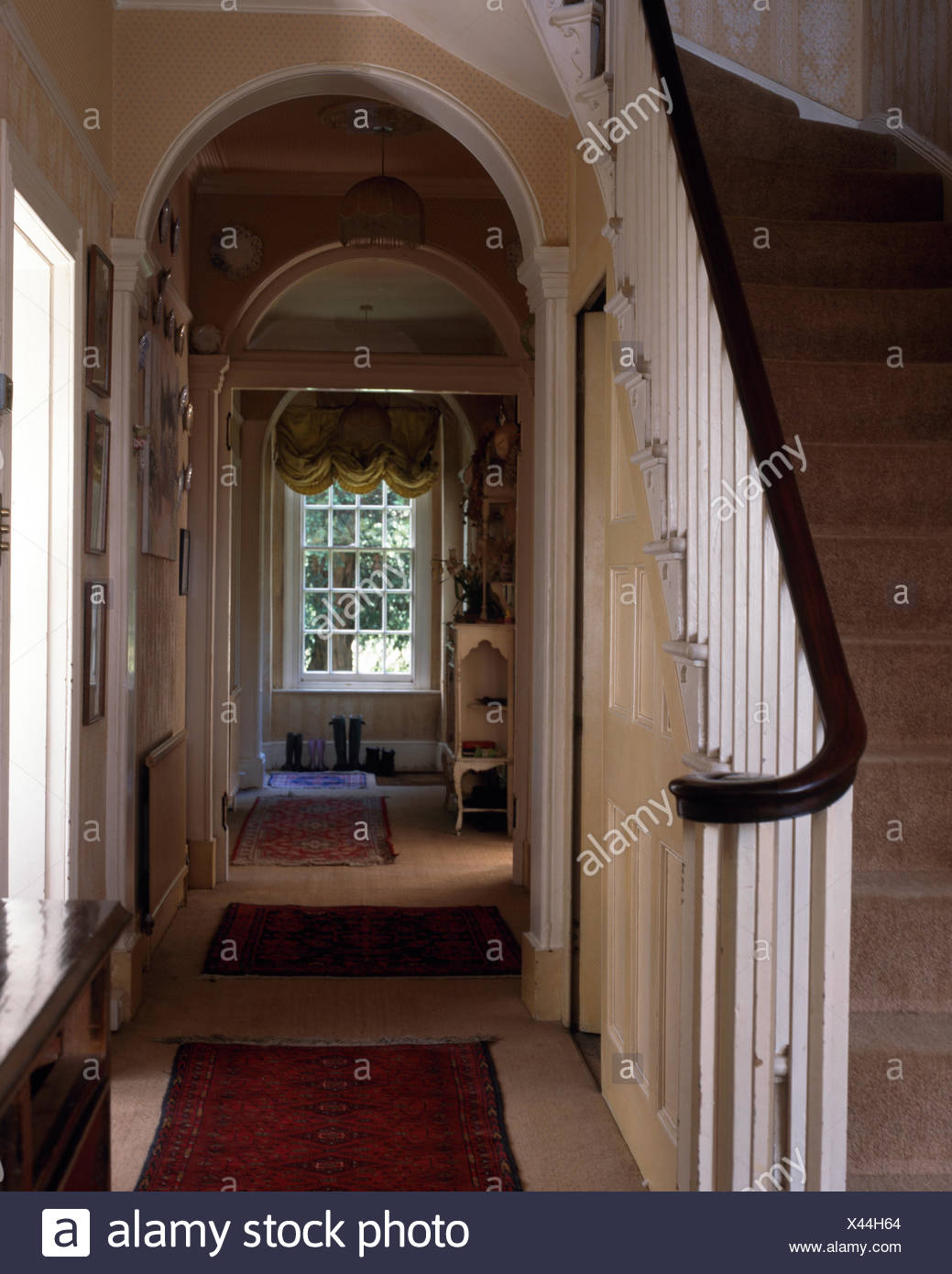Oak Handrail And White Banisters On Staircase In Georgian Style