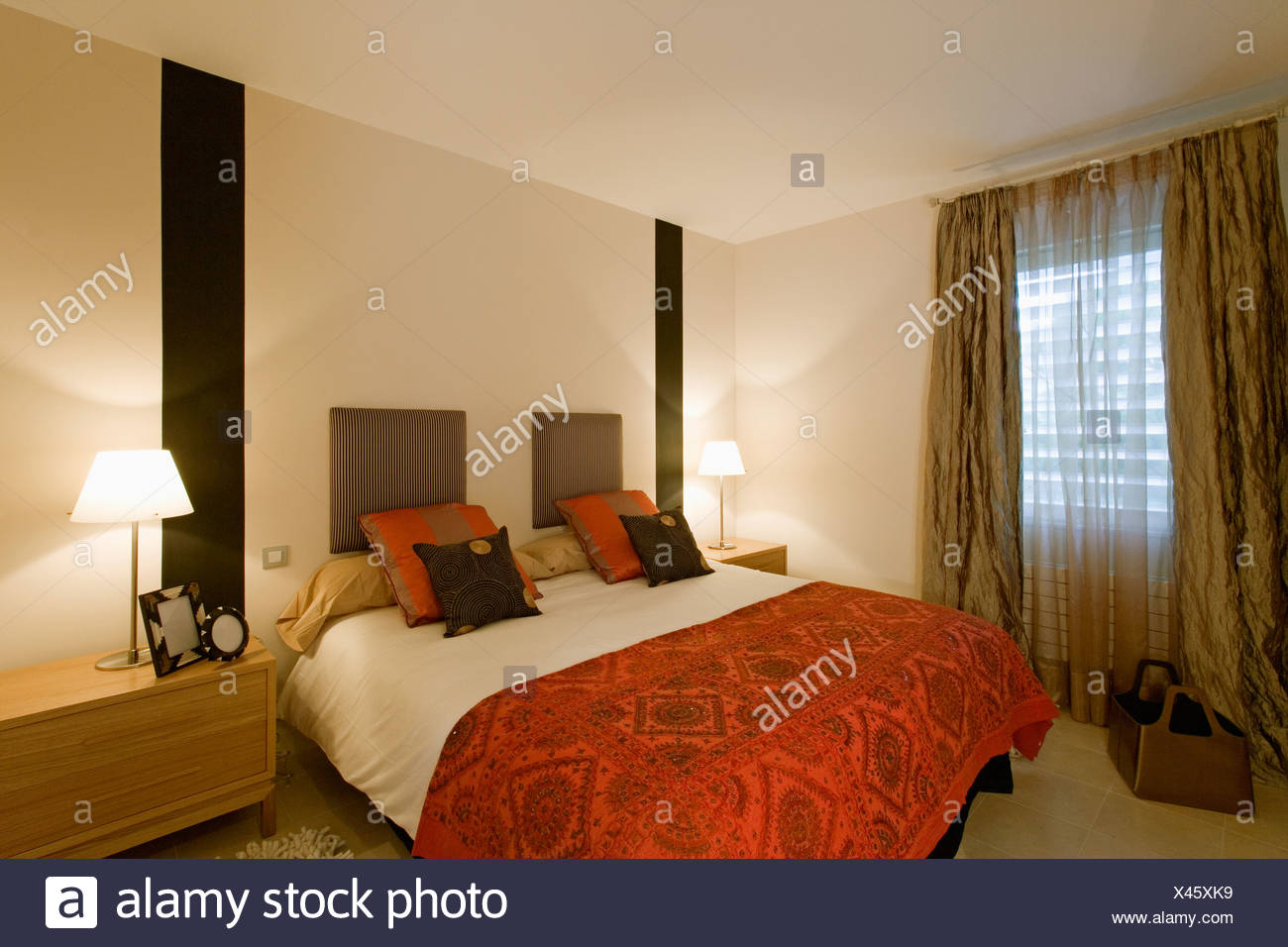 Black Stripes On Wall On Either Side Of Bed With Patterned