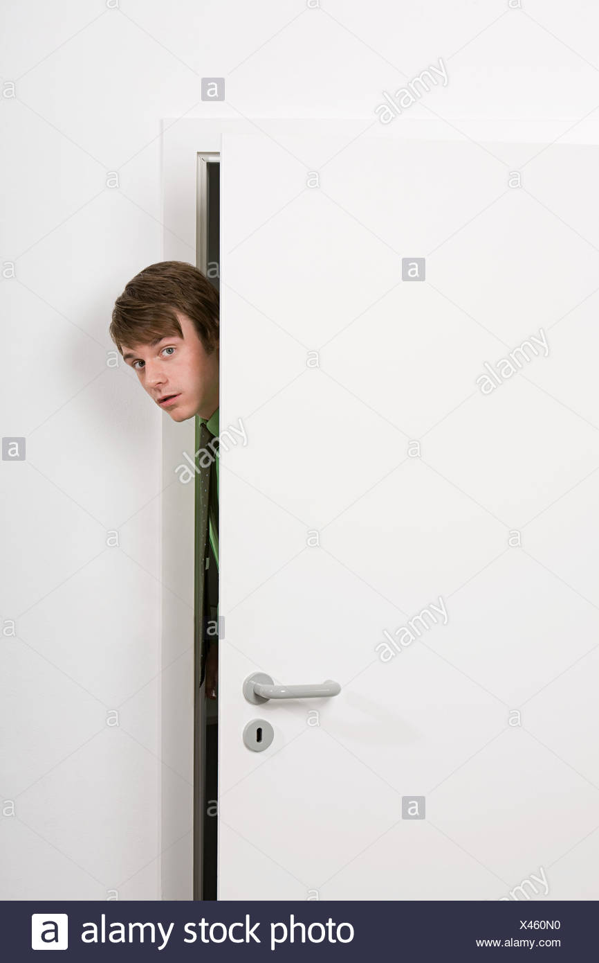 Man Peeking Door Stock Photos & Man Peeking Door Stock Images - Alamy