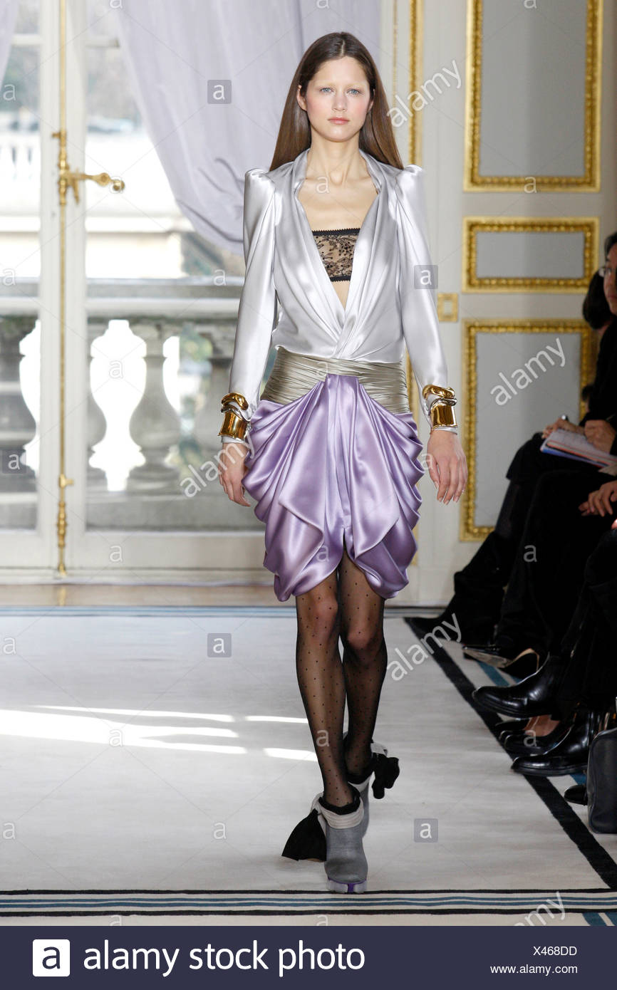 Balenciaga Paris Ready to Wear Autumn Winter Silver silk blouse over a  black lace bra top, lilac short silk swagged skirt Stock Photo - Alamy