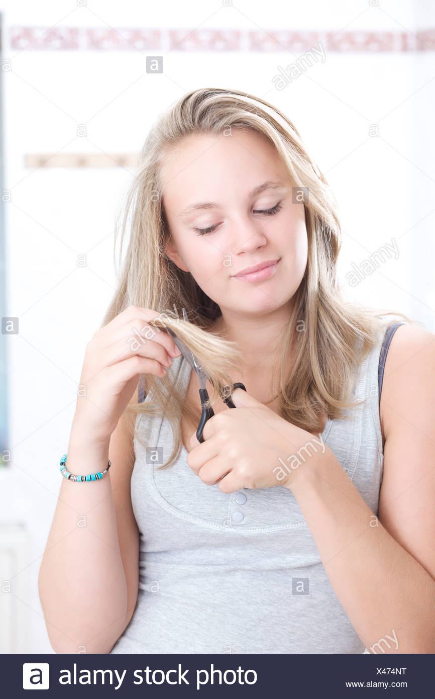 Teenage Girl Cutting Her Own Hair Stock Photo 277981924 Alamy