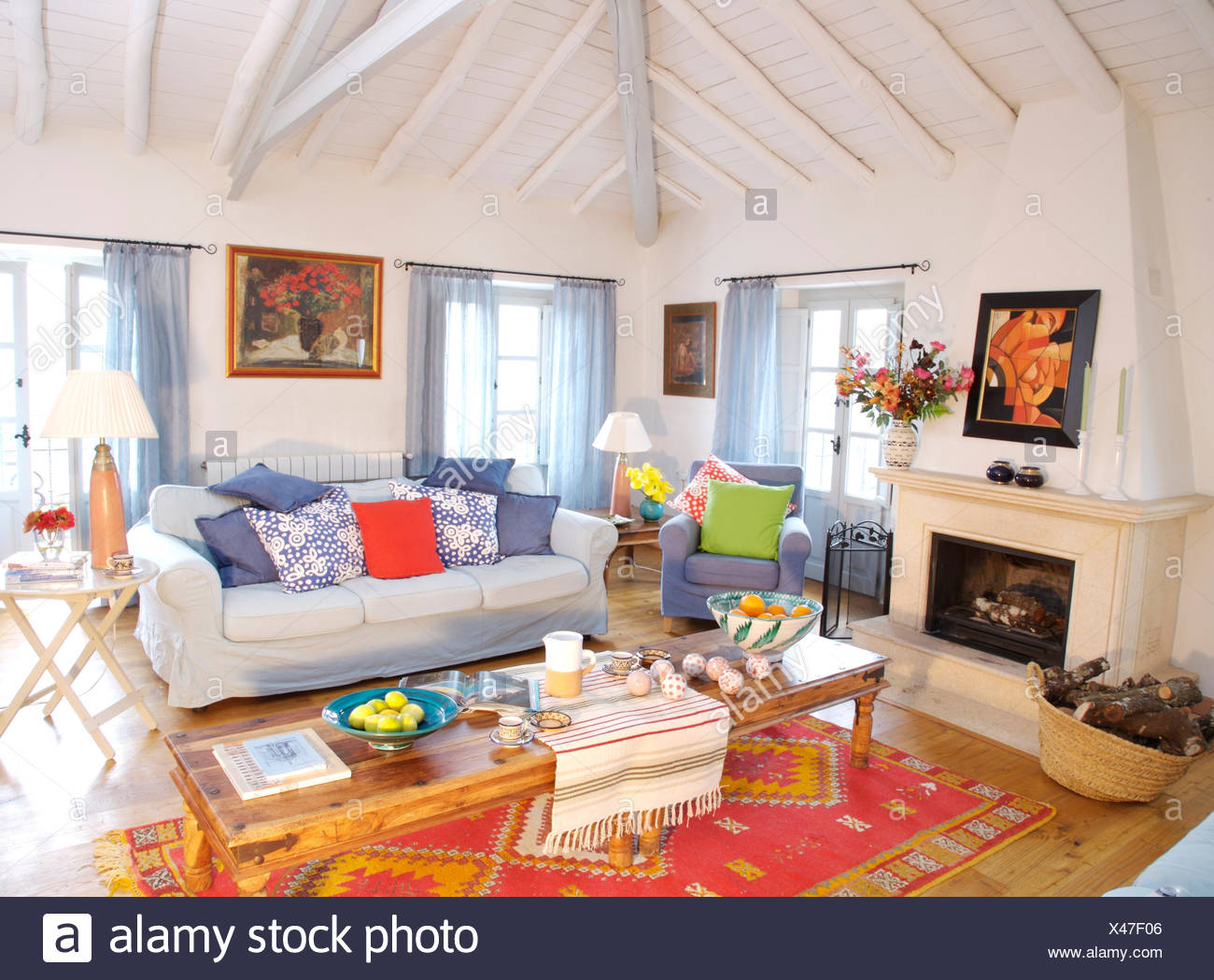 white sofa with colorful pillows