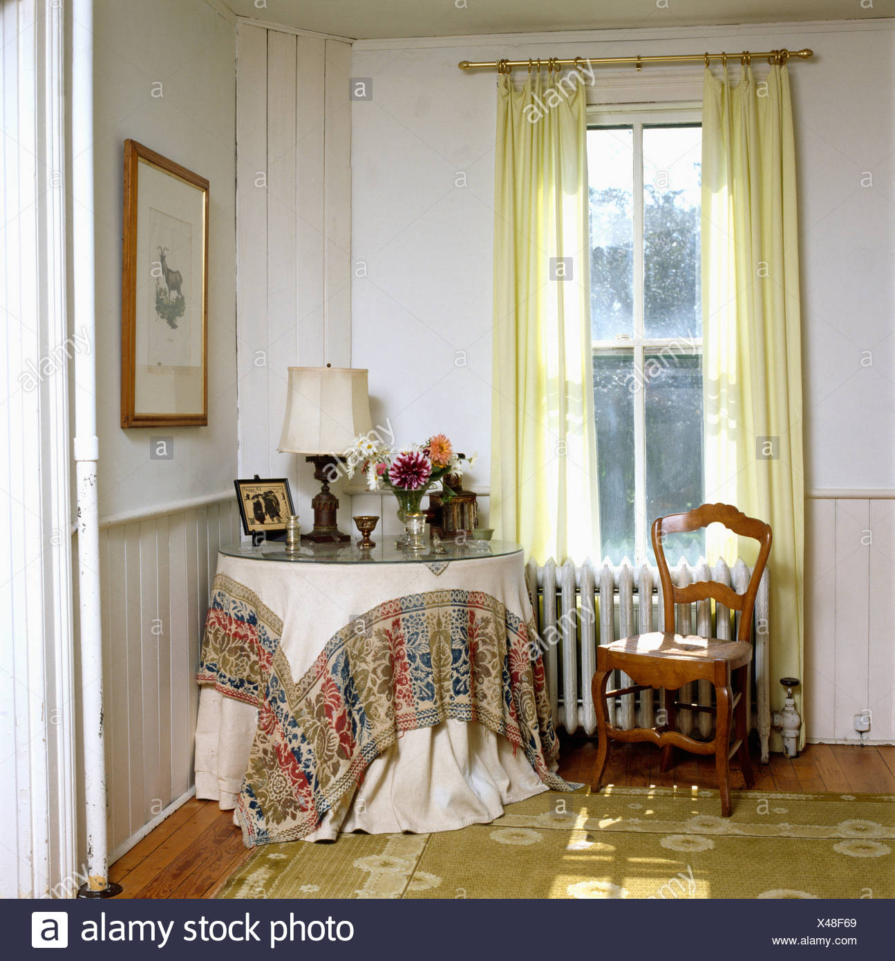 Cloth With Patterned Hem On Circular Table In Corner Of Sitting