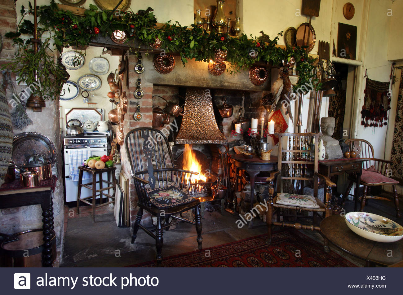 Kitchen With Stone Floor Chairs Around Fireplace Stock Photo