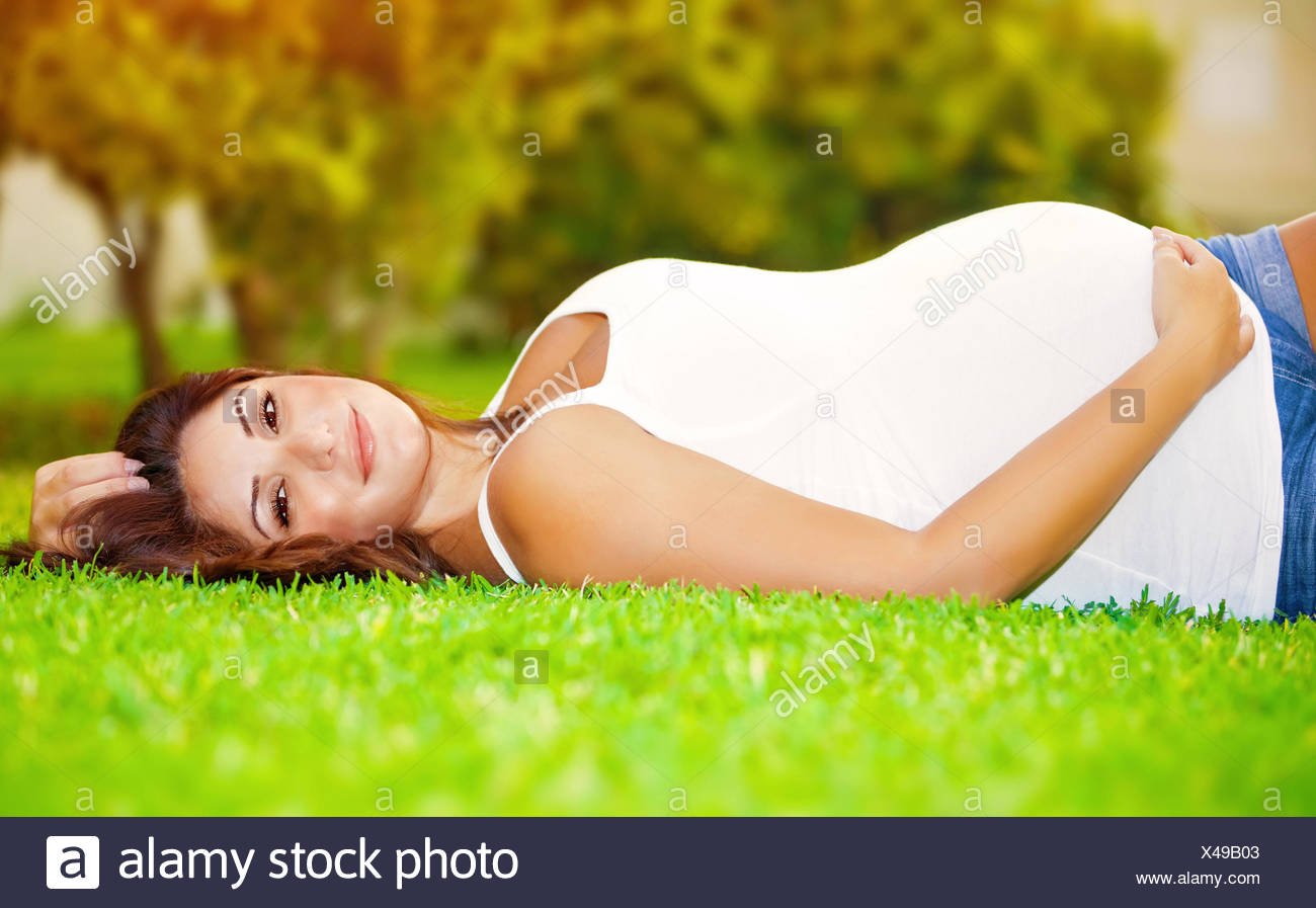 Pregnant Woman Lying Down High Resolution Stock Photography and Images